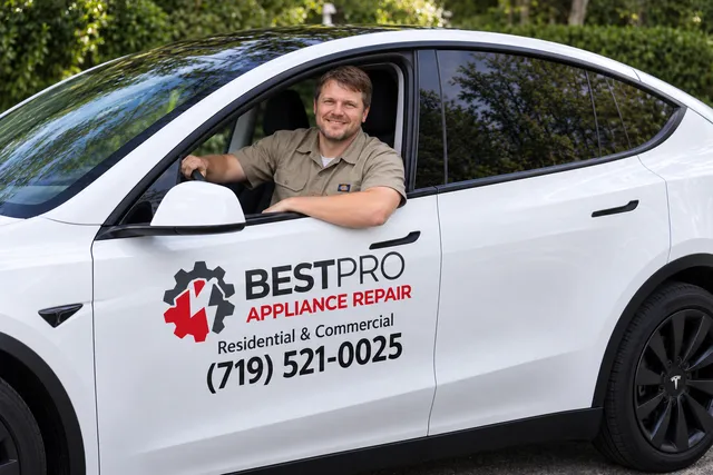 Best Pro Appliance Repair technician in a white branded company car